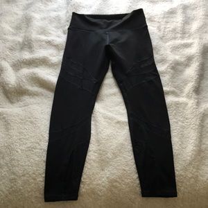 Black workout leggings with see through “cut outs”